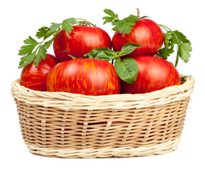 Tomatoes in the basket isolated on white