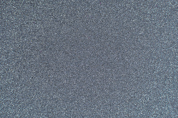 Texture of wrapping paper from  shiny glitter. Defocus, abstract background.