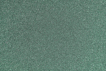 Texture of wrapping paper from  shiny glitter. Defocus, abstract background.