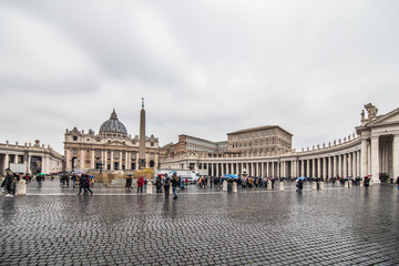 Fototapeta na wymiar VATICAN CITY - November, 2018: St. Peter's square in front of world's largest church. Papal Basilica of St. Peter's a grandiose elliptical esplanade created in the mid seventeenth century.