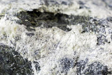 Mineral asbestos macro photography. Harmful, dangerous minral. Asbestos fibers in rock close-up.