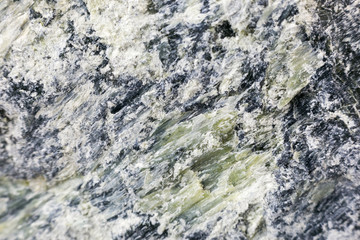 Mineral asbestos macro photography. Harmful, dangerous minral. Asbestos fibers in rock close-up.