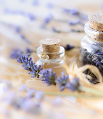 Obraz na płótnie Canvas Lavender essential oil and dried lavender flowers.