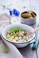 Russian olivier salad with meat and vegetables