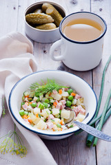 Russian cold soup okroshka with meat and vegetables