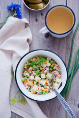 Russian cold soup okroshka with meat and vegetables