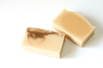 Natural oatmeal soap is placed on a white background.