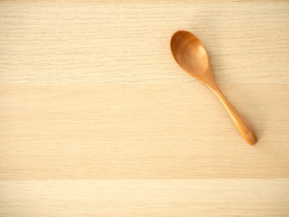 Wooden spoon on a wooden table