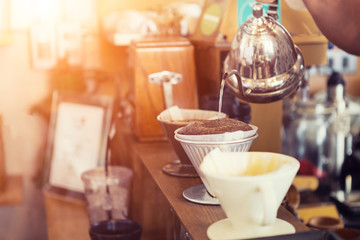 Hand drip coffee. Hot coffee ground with filter in cafe.