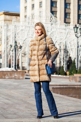 Young beautiful woman in winter coat