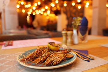 Grilled shrimps on restaurant table