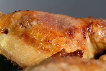 Piece of fried chicken on a platter. Shallow depth of field