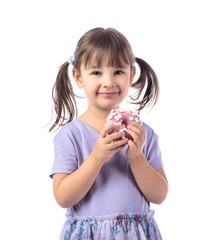Four-year-old girl eat donut.