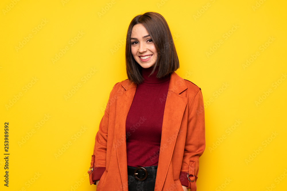 Wall mural portrait of young woman over white wall