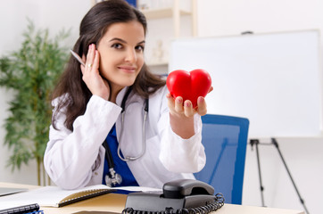 Female doctor cardiologist working in the clinic 