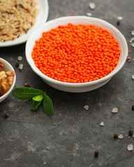 Lentils orange, healthy food concept (legumes, greens, spinach, micro greens and more) superfood. Food background