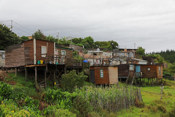 Fototapeta na wymiar Crowded, poor and very shaky shacks