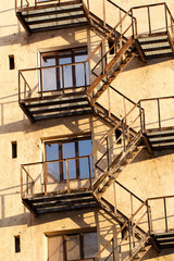 building facade with windows and fire escape
