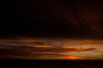 Fototapeta na wymiar Cloudy sunset over the sea