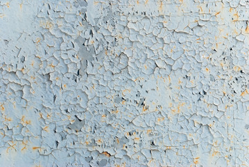 metal wall with cracks from paint. old wall background.