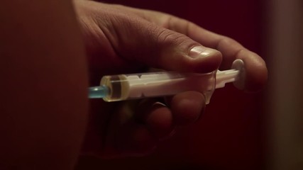 Close up of a bodybuilder getting a anabolic steroid injection