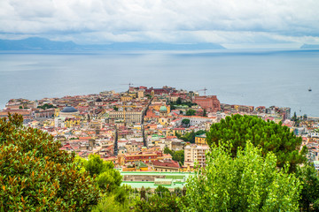 Fototapeta na wymiar Naples, Italy - August 16, 2015 : A view over the rooftops of Naples.