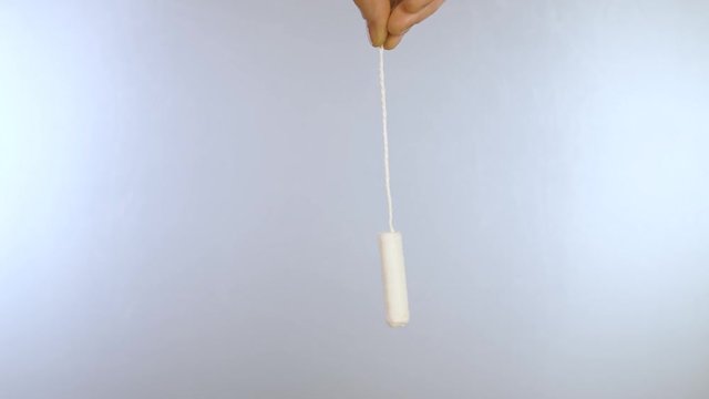 Close up swinging tampon without applicator