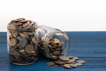 Jars of Coins on a Blue Board