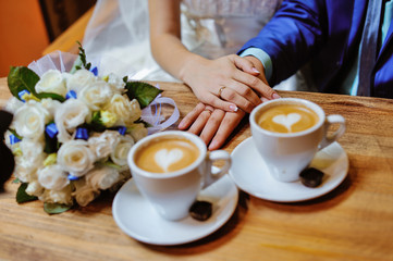 man and woman hands. love and cup coffee concept