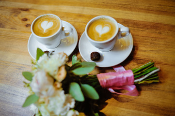 Wedding bouquet with a cup of coffee