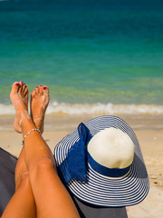 Fototapeta na wymiar Woman legs at the beach