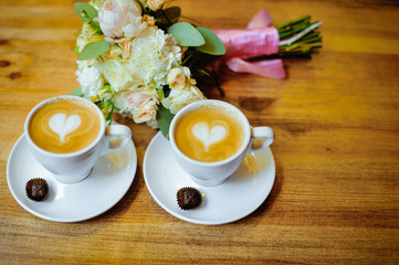 Wedding bouquet with a cup of coffee