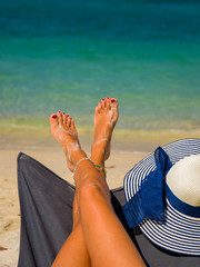 Woman legs at the beach