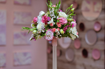 bridal beautiful bouquet made of different flowers on grey background. colorful color mix flower. close-up