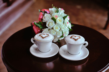 Wedding bouquet with a cup of coffee