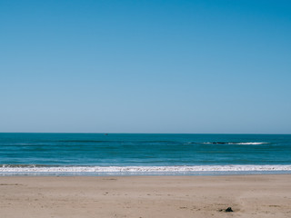 Fototapeta na wymiar Shore of the beach with clear water