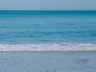 Shore of the beach with clear water
