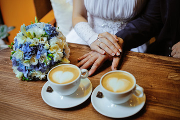 man and woman hands. love and cup coffee concept