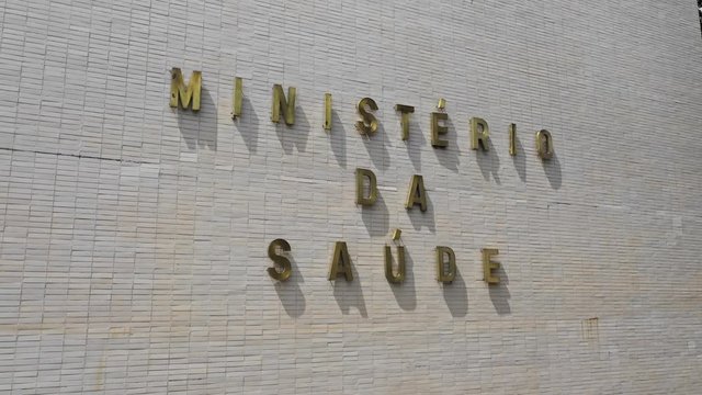 Drone shot of a Minsterio Da Saude sign in Brasilia's federal district. Pull back shot.
