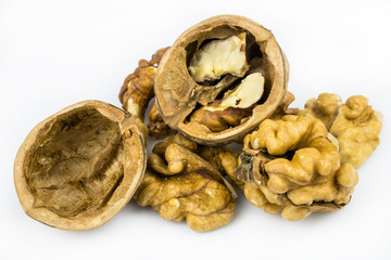Chopped walnuts, shells, isolated on a white background.
