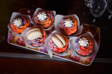 Fresh cupcakes with whipped cream and cream