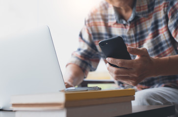 Fototapeta premium Man using smartphone