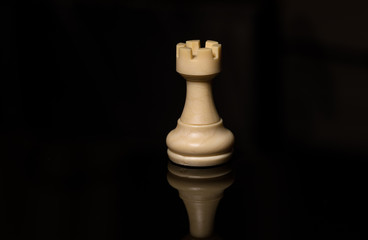 Classic Chess White Rook on black board, isolated