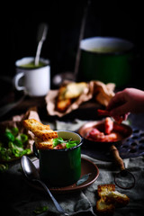 Brussels sprouts soup with bacon.dark photo