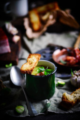 Brussels sprouts soup with bacon.dark photo