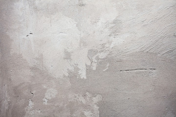 The texture of the wall plastered with sand and cement plaster.