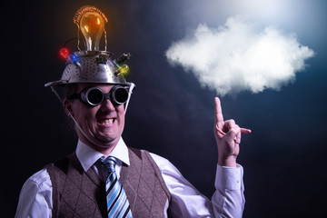 distraught looking conspiracy believer in suit with aluminum foil head with chemtrails cloud...