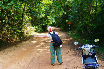 Traveler on forest road in Phu Quoc
