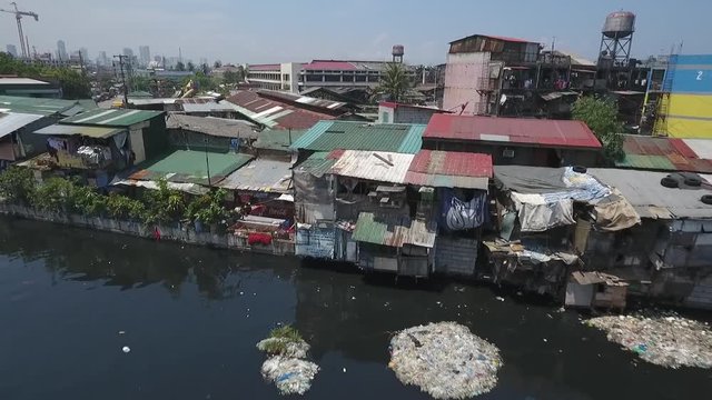 Aerial of Slum Area along the polluted canal in Tondo Manila, Philippines
