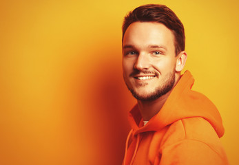 Obraz premium Young man over yellow background